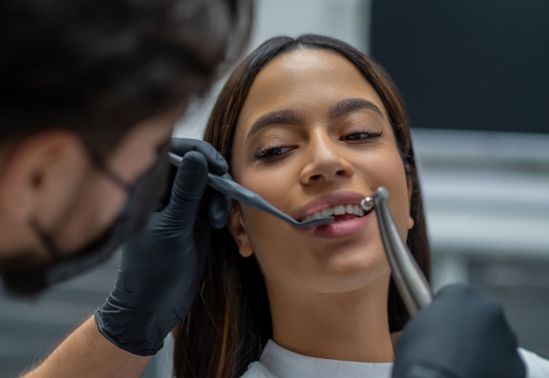 A patient receiving cosmetic dental treatment with a dentist in a dental clinic in Warrenville, IL